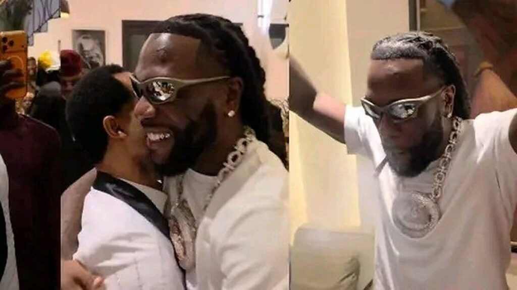 Burna Boy, lunettes de soleil, enlace un invité lors d’une fête privée